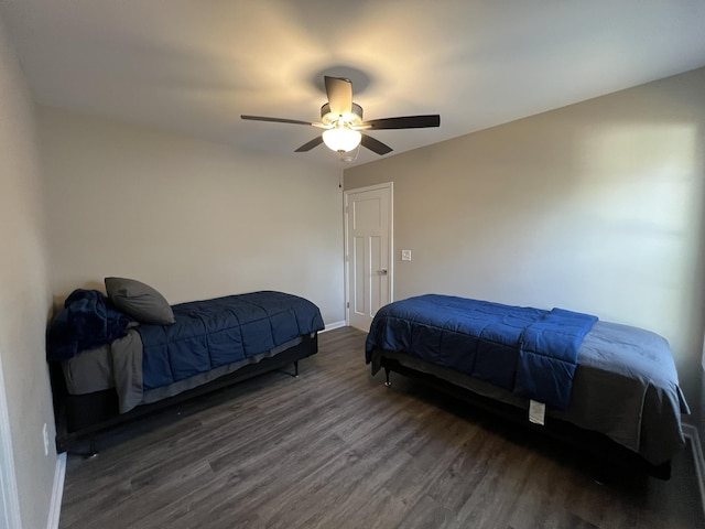 bedroom featuring ceiling fan and dark hardwood / wood-style floors