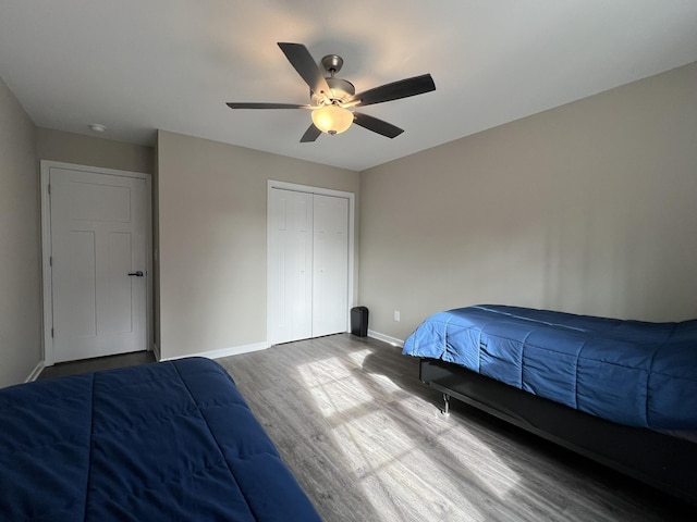 bedroom featuring a closet, ceiling fan, and hardwood / wood-style floors