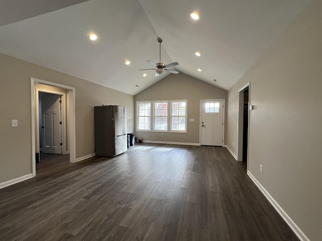 unfurnished living room featuring ceiling fan, dark hardwood / wood-style flooring, and lofted ceiling