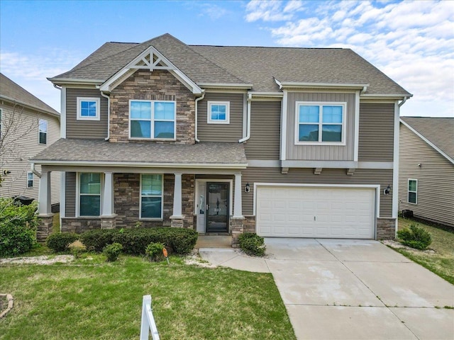 craftsman-style home with a front yard and a garage