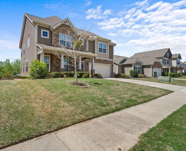 view of front facade featuring a front yard and a garage