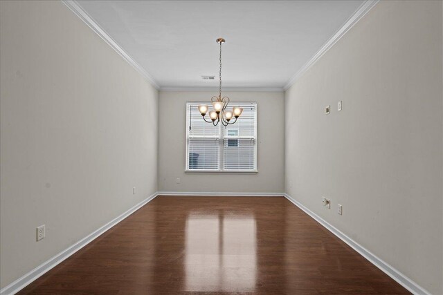 unfurnished dining area with a notable chandelier, dark hardwood / wood-style floors, and ornamental molding