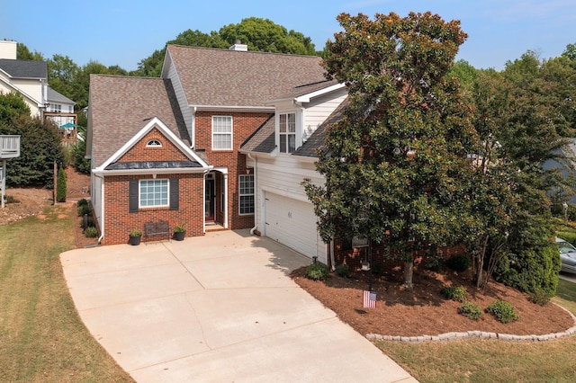 view of front facade with a garage and a front yard