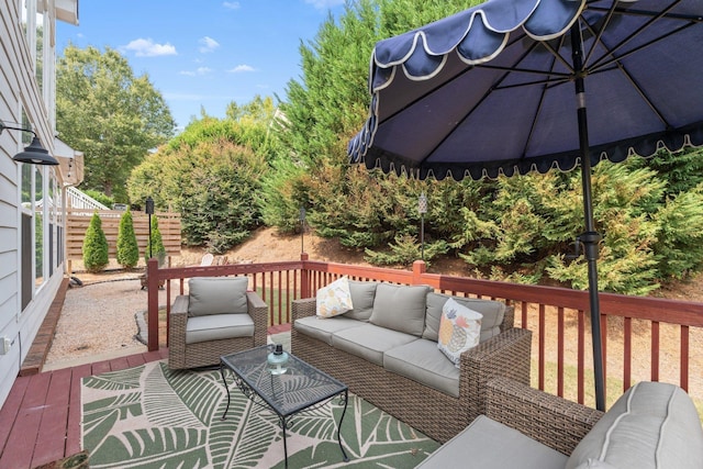 wooden terrace featuring an outdoor hangout area