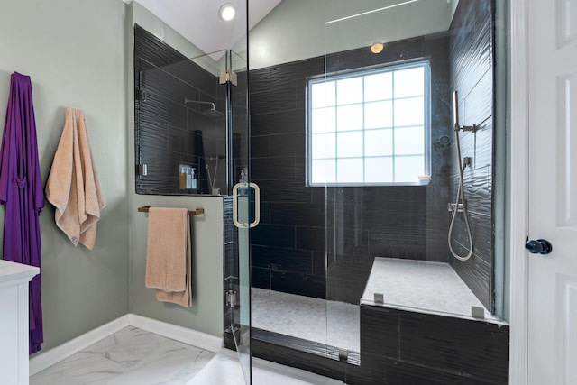 bathroom with tiled shower