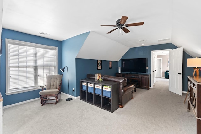 carpeted living room featuring ceiling fan and lofted ceiling