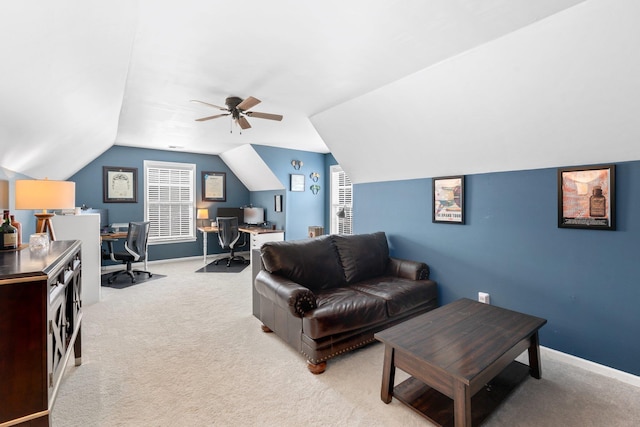 carpeted living room featuring ceiling fan and lofted ceiling