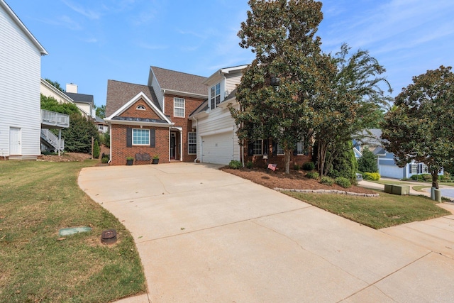 view of front of home featuring a garage and a front yard