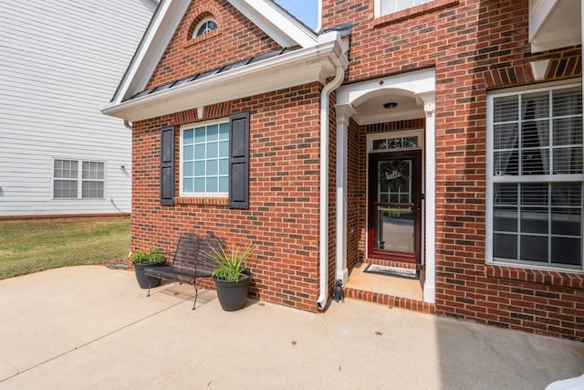 doorway to property featuring a patio area