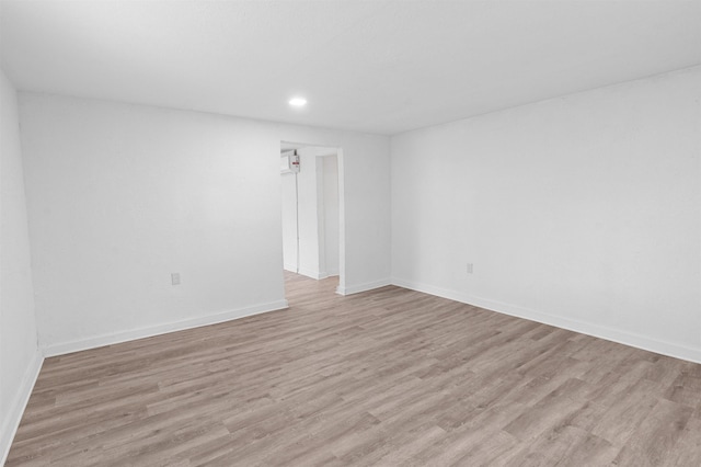 empty room with light hardwood / wood-style floors