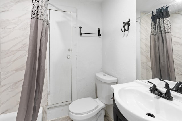 bathroom featuring vanity, toilet, and walk in shower