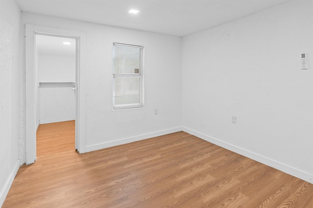 spare room with light hardwood / wood-style floors