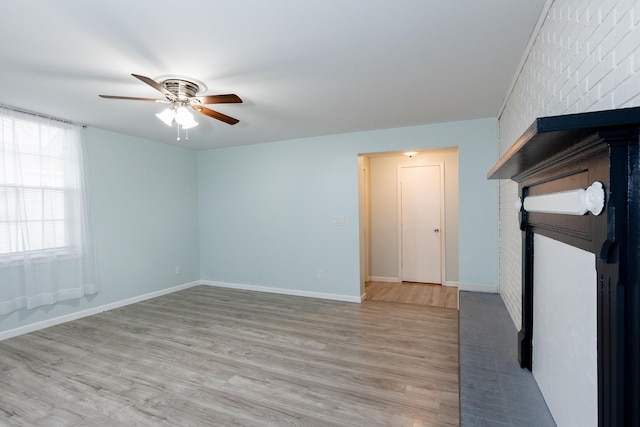 spare room featuring light hardwood / wood-style floors and ceiling fan