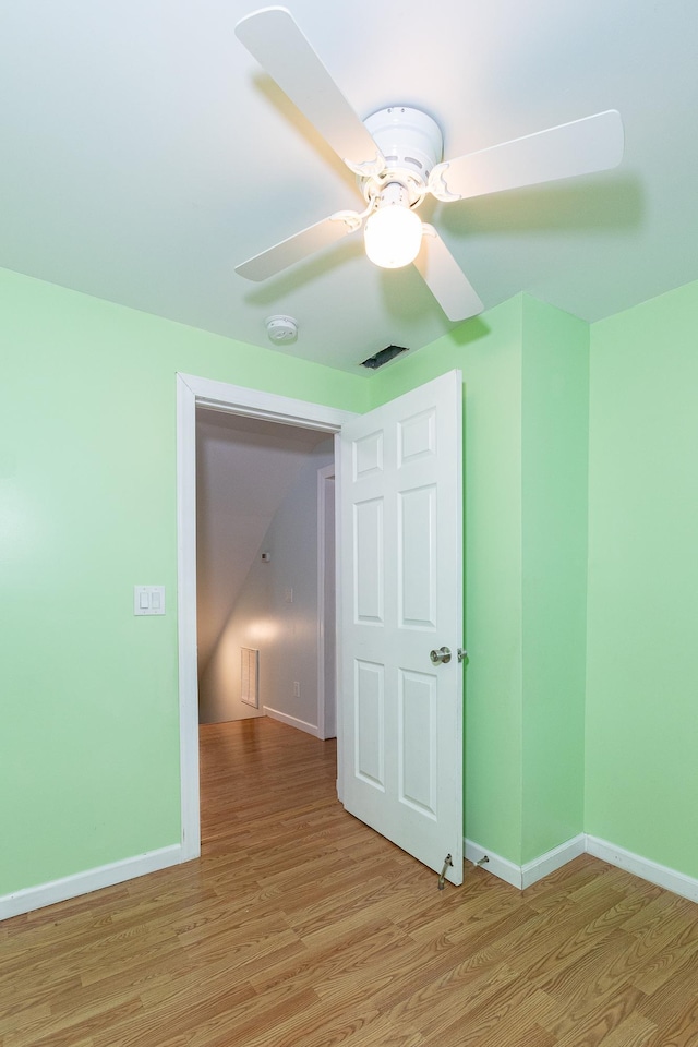 spare room featuring ceiling fan and light hardwood / wood-style floors