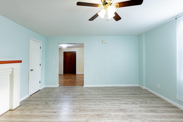 unfurnished living room with ceiling fan and light hardwood / wood-style flooring