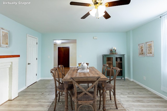 dining room featuring ceiling fan and light wood-type flooring