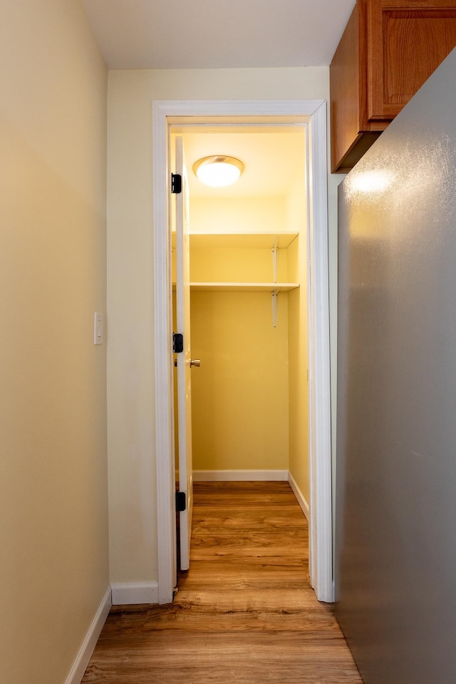 walk in closet featuring light hardwood / wood-style floors