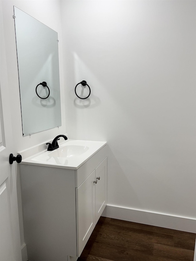 bathroom featuring hardwood / wood-style floors and vanity