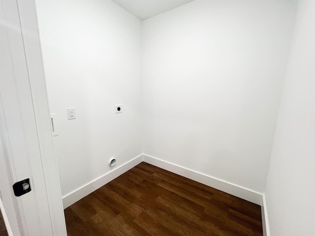 clothes washing area featuring electric dryer hookup and dark wood-type flooring