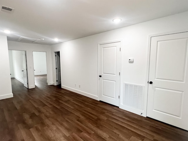 empty room featuring dark wood-type flooring