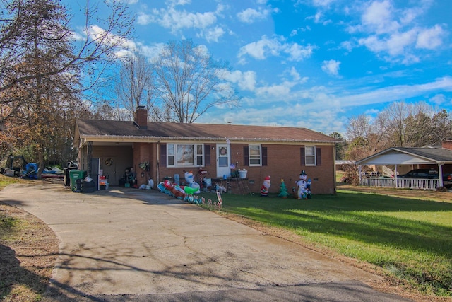 single story home with a front lawn and a carport