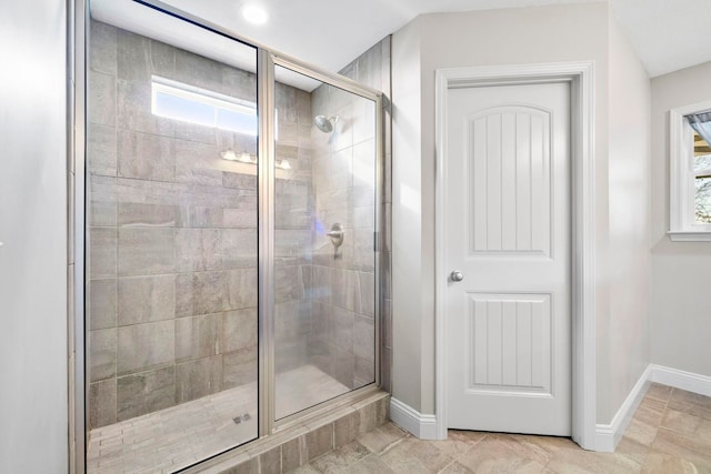 bathroom featuring tile patterned flooring and a shower with door