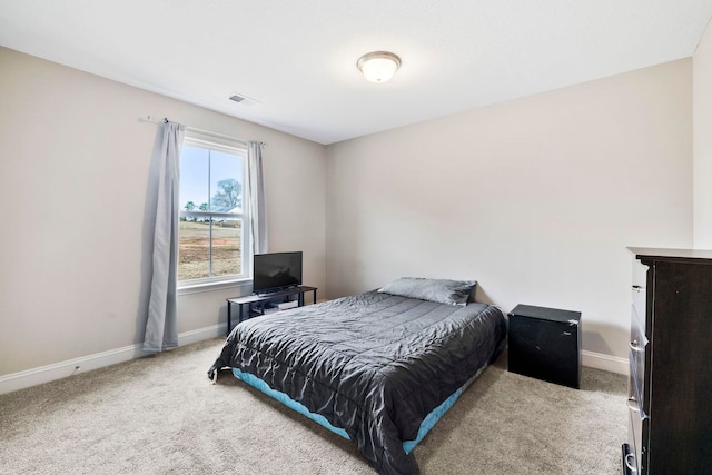 bedroom with light carpet