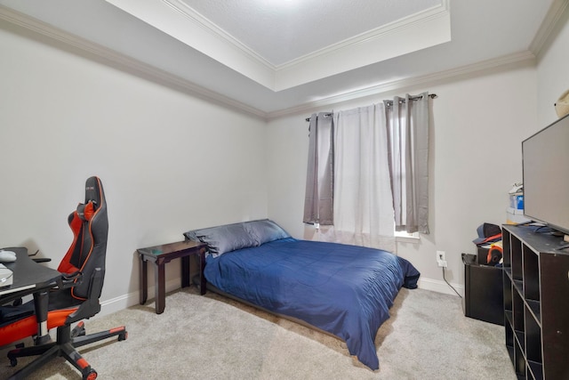 carpeted bedroom featuring a raised ceiling and crown molding