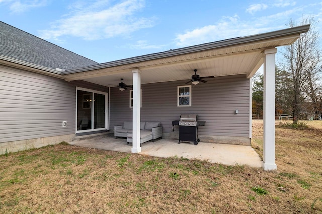 back of house with ceiling fan, a patio area, and a lawn