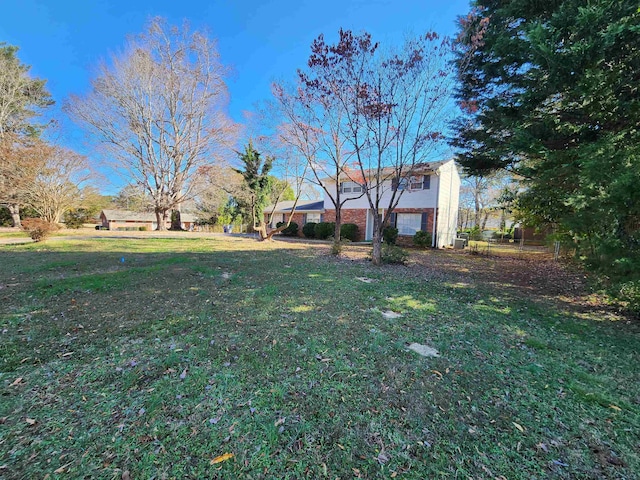 view of yard with a garage