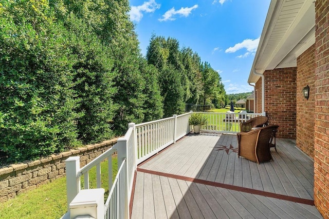 wooden deck with a yard