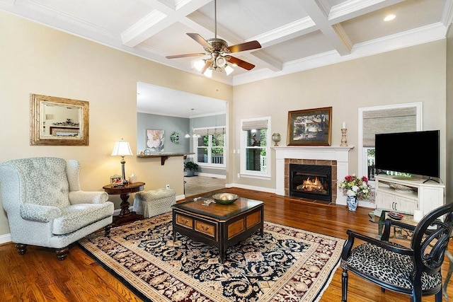 living room with hardwood / wood-style flooring, beam ceiling, a fireplace, and coffered ceiling