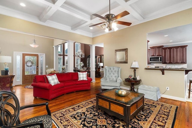 living room featuring ornate columns, ornamental molding, coffered ceiling, beam ceiling, and light hardwood / wood-style flooring