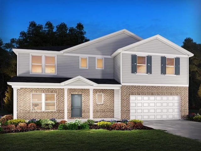 view of front facade featuring a front yard and a garage