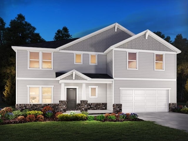 view of front of house with a garage and a front yard