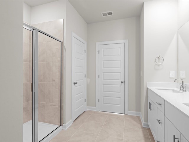 bathroom with vanity, tile patterned floors, and walk in shower