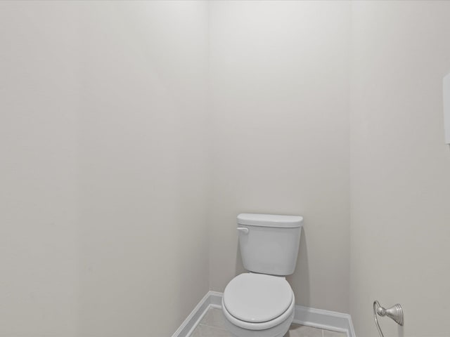 bathroom with tile patterned flooring and toilet