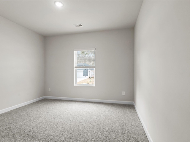 spare room featuring carpet flooring