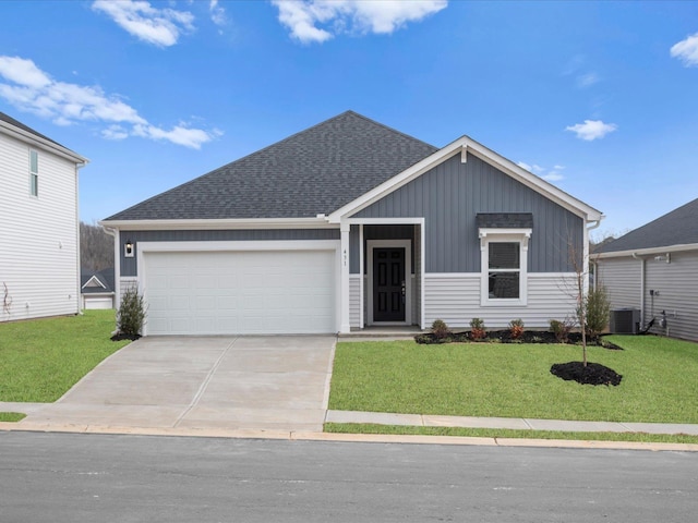 view of front of property featuring a garage and a front yard