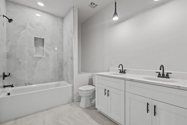 full bathroom with vanity, toilet, and tiled shower / bath combo