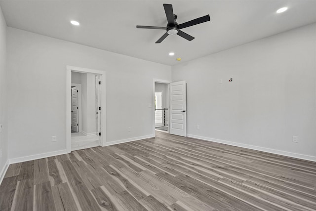 unfurnished room featuring light hardwood / wood-style flooring and ceiling fan