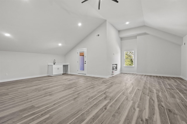 bonus room featuring ceiling fan, light hardwood / wood-style floors, and lofted ceiling