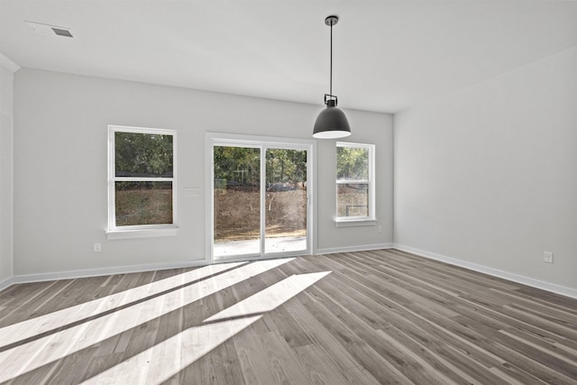 unfurnished dining area with hardwood / wood-style flooring