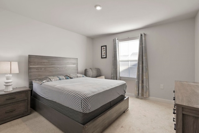 bedroom featuring light colored carpet