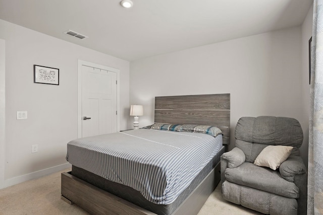 bedroom featuring light carpet