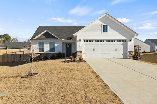 view of front of home with a front yard and a garage