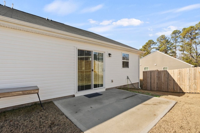 back of house with a patio