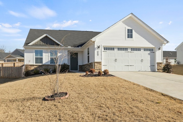 view of front of house with a front yard and a garage