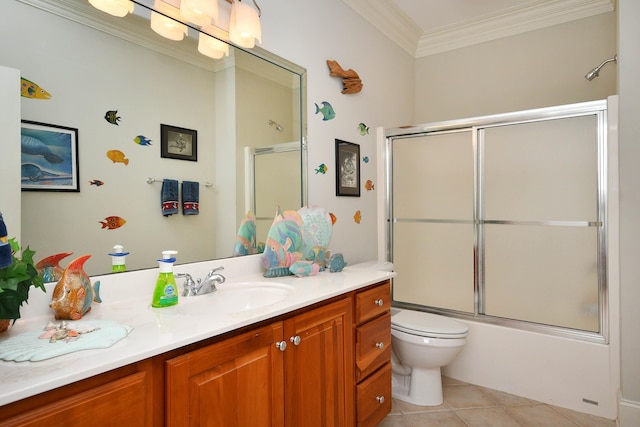 full bathroom featuring combined bath / shower with glass door, ornamental molding, vanity, tile patterned flooring, and toilet