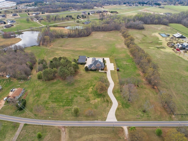 drone / aerial view featuring a water view and a rural view